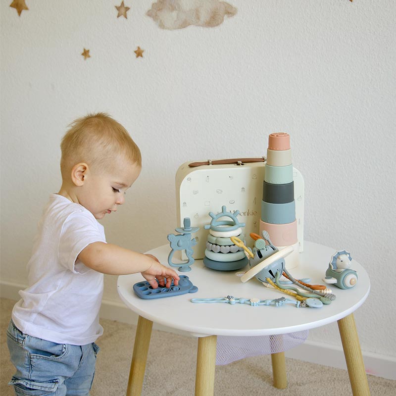 A boy is playing Moonkie's playtime set.