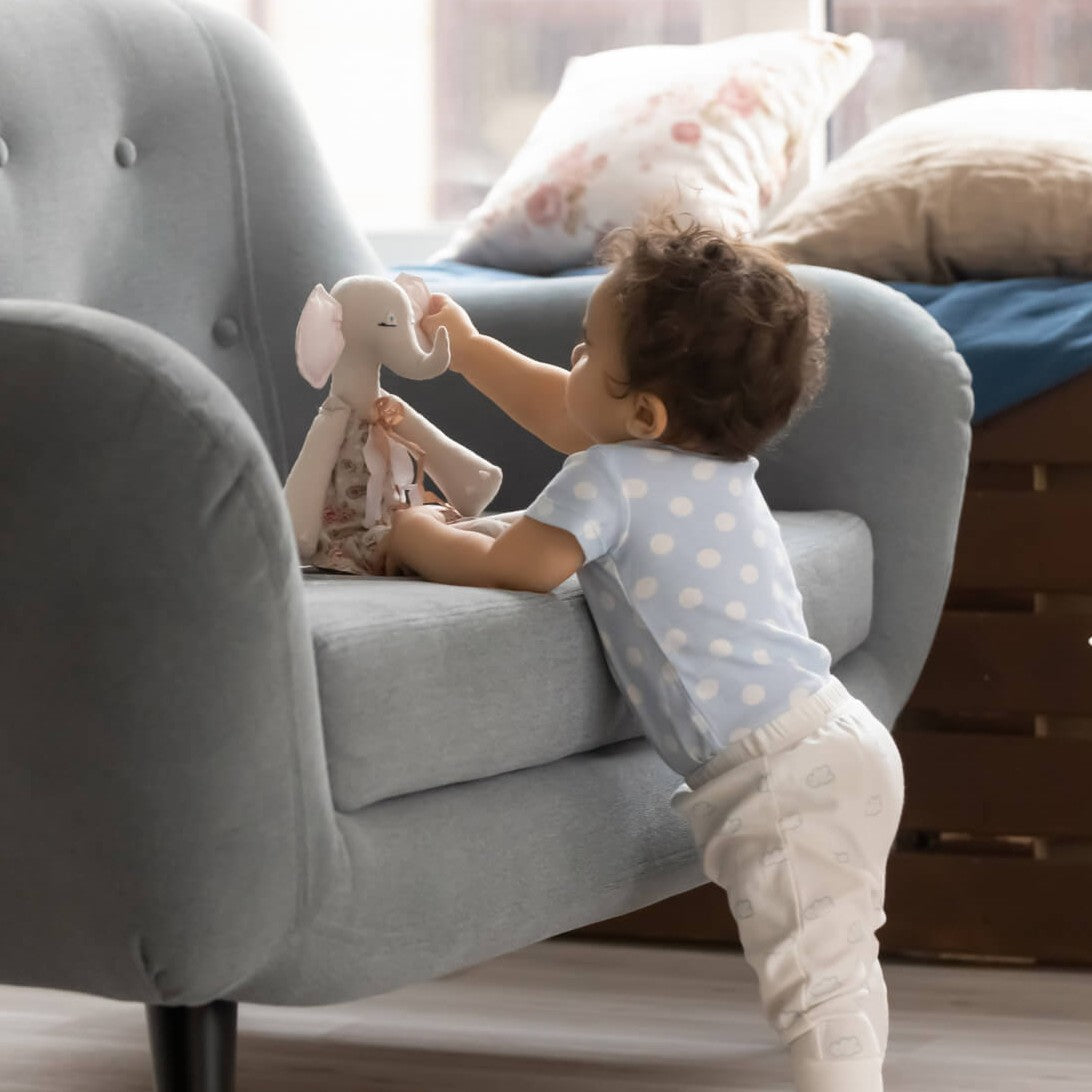 Little biracial toddler baby playing at home