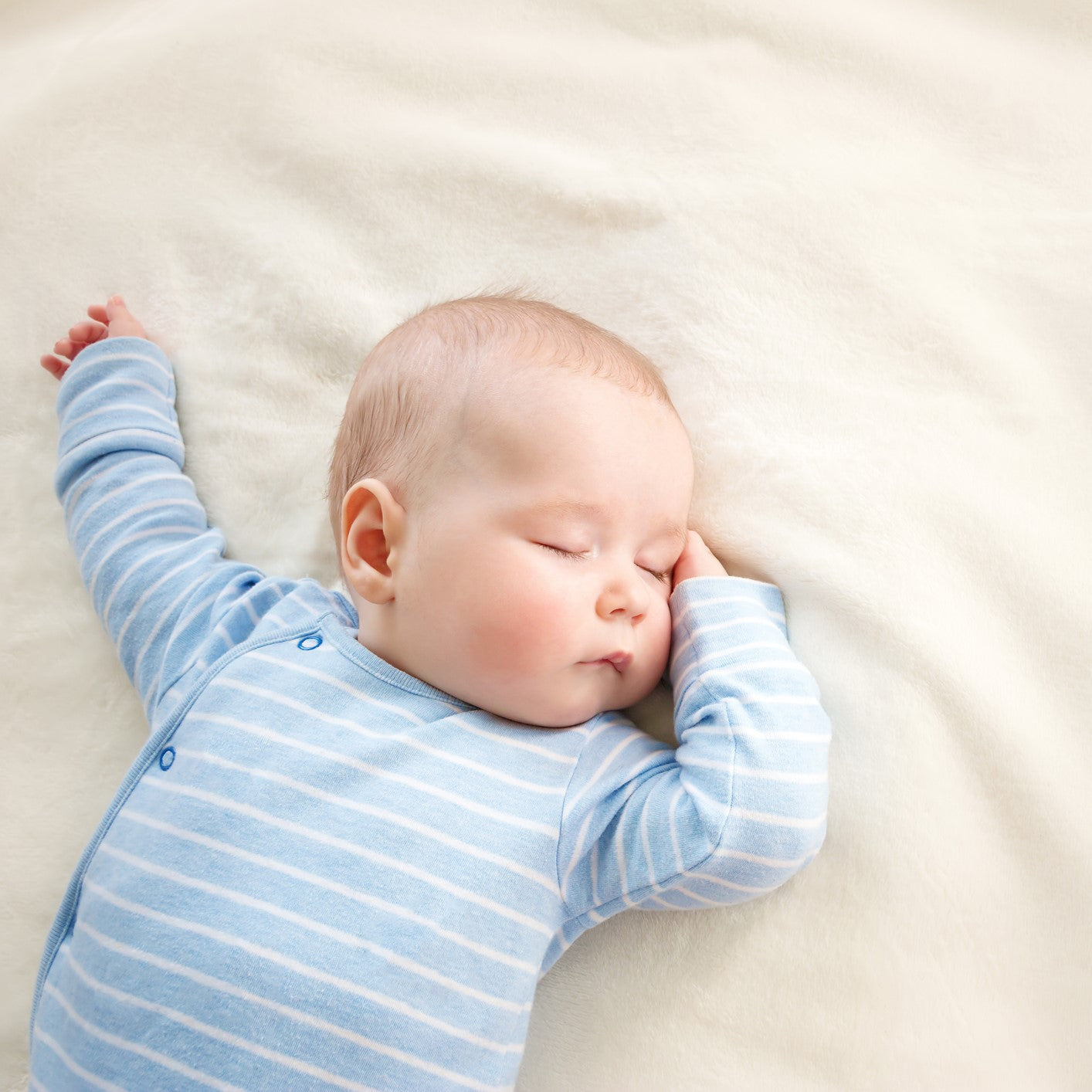 Baby sleeping covered with soft blanket