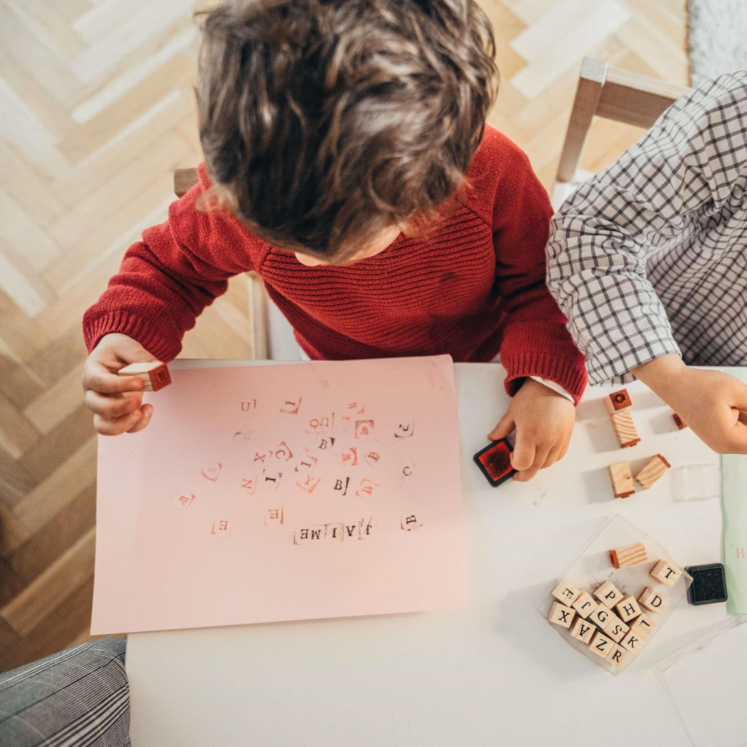 boys  are drawing at home