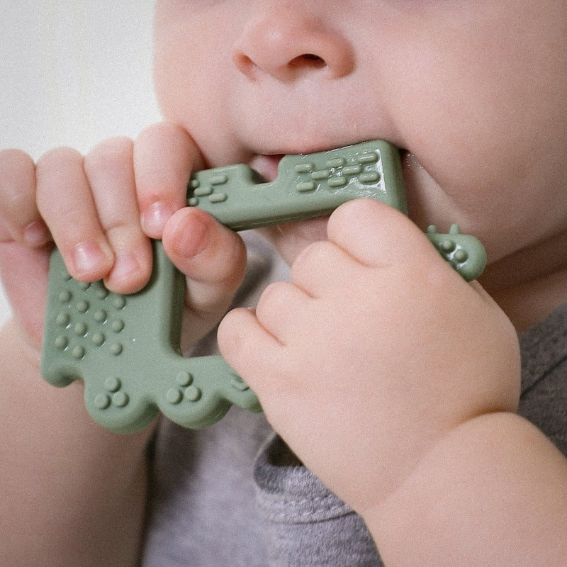 baby using Sage Alligator Teether