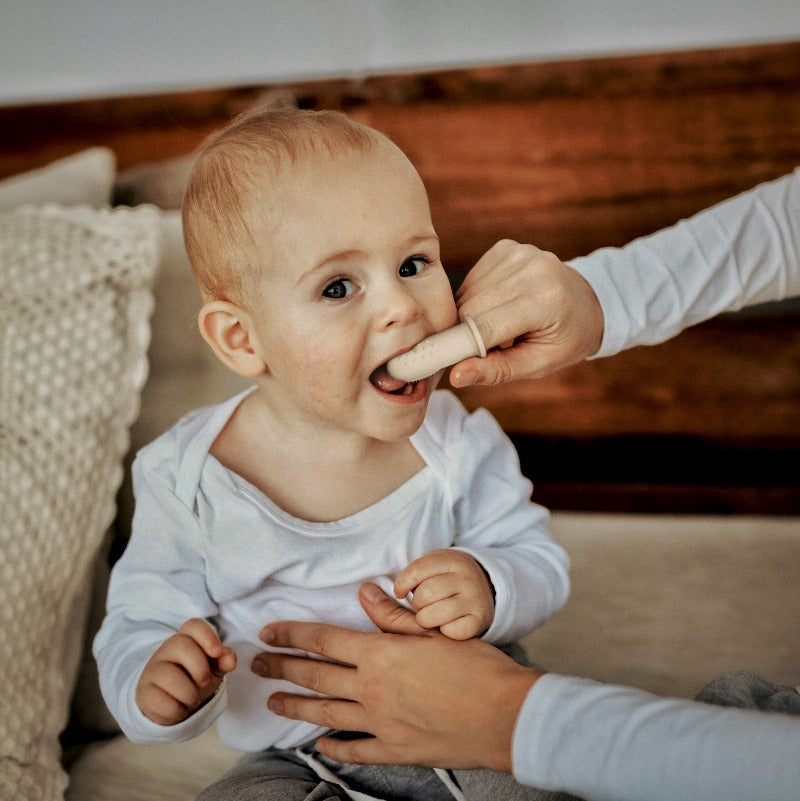 Baby Using Finger ToothBrush