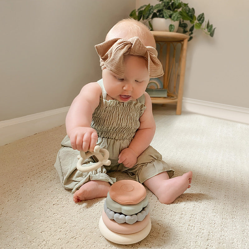 Baby Playing With Stacking Teething Rings Original