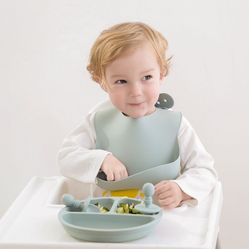 Baby Using Sage Bib