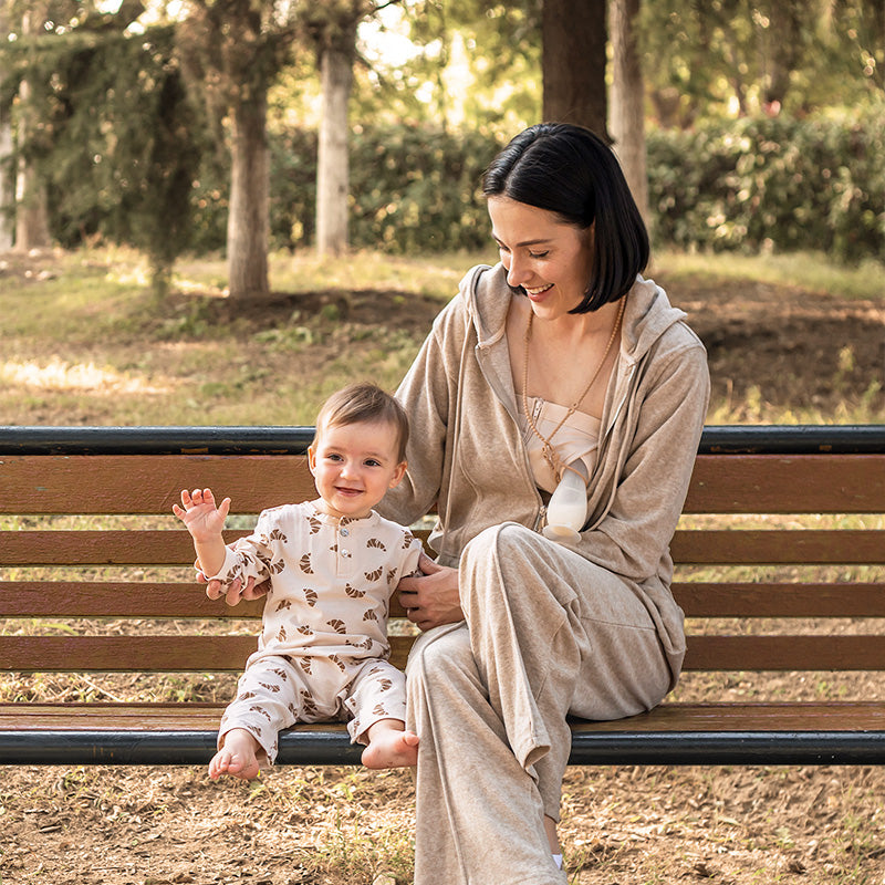 Mom Using Silicone Breast Pumps at the Outside